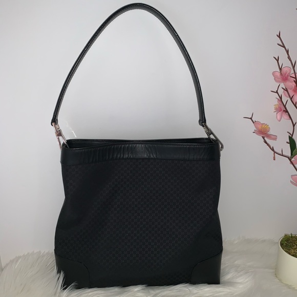 Gucci Handbags - Authentic Gucci Black GG Canvas Shoulder Bag.